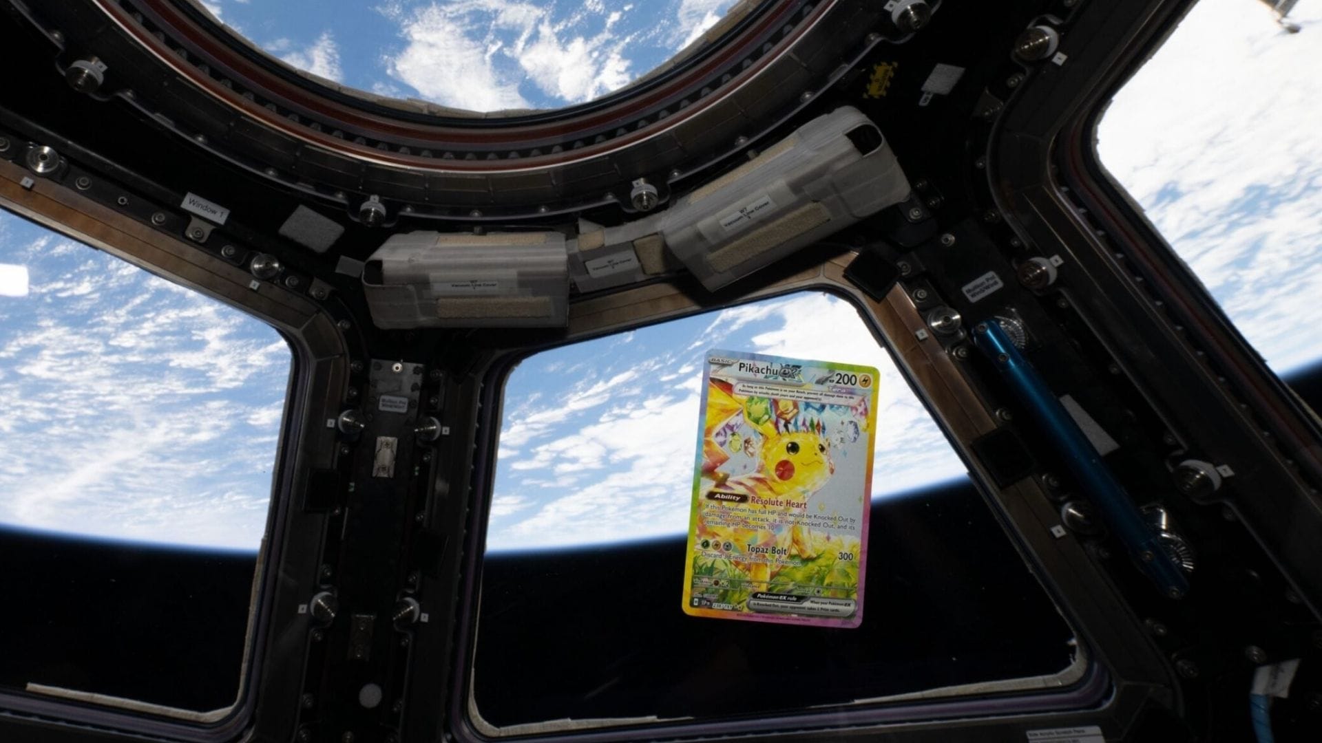 A Pikachu ex #238 Pokémon card floating inside the ISS in front of the Earth