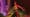 Key art of a character holding a smashed bottle in a bar for Cyberpunk TCG Holophone details